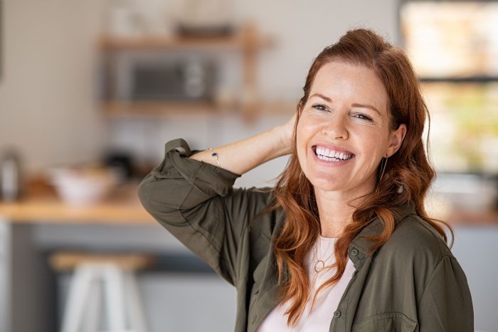 happy woman experiencing early menopause